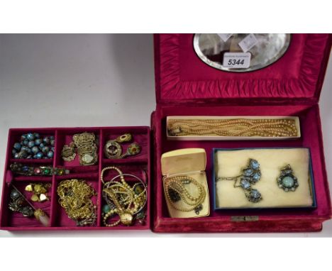 An early 20th century velvet jewellery box, fitted silk lined interior; jewellery including Monet bangle, chains, bracelets, 