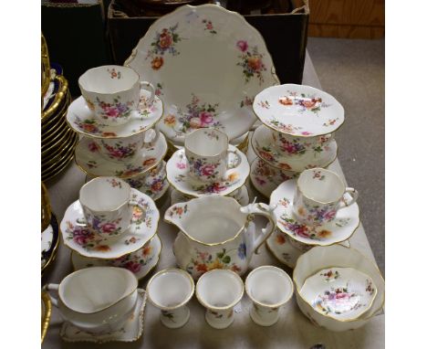 A Royal Crown Derby Posies pattern part tea set, including cups saucers, side plates, bread and butter plates, milk jug and s