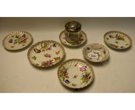 An Edwardian silver topped dressing table jar, Birmingham 1904; a Dresden saucer, painted with colourful summer flowers, pain