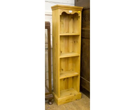 A modern pine three-shelf bookcase, 120H x 30W x 25cmD