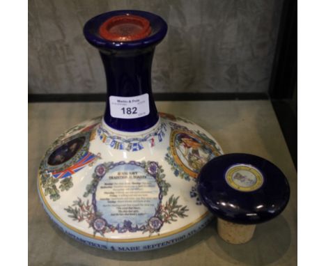 A Wade Pussers Rum Royal Navy commemorative ceramic ships decanter, wax sealed and with cork and ceramic stopper 