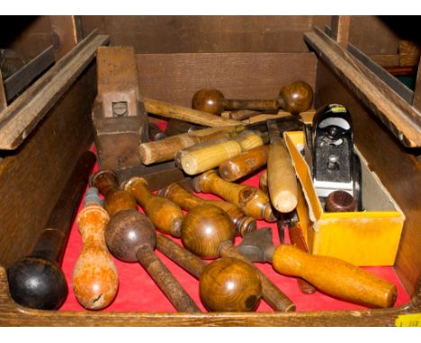 An assortment of old tools including planes and chisels 