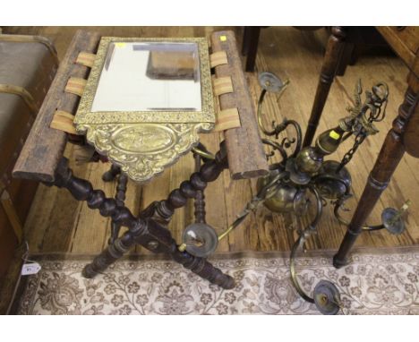 A copper dolly, brass ceiling light, a folding luggage stand and a brass mirror 