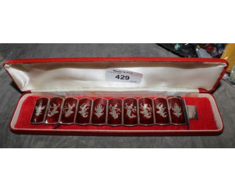 A good Siamese sterling silver and red enamel panels bracelet with relief silver images of dancers in original red bracelet c
