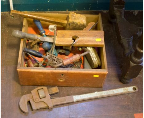 A selection of tools and iron trivet