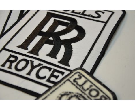 This item is a patch set with the Rolls-Royce logo in black with a white background. The two larger ones measure 5X7 and the 