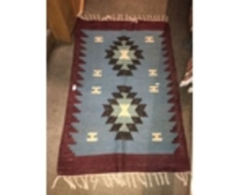 A Turkish Kilim blue ground carpet, 130cm x 86cm.