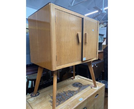 A retro mid 20th century light oak record cabinet. 