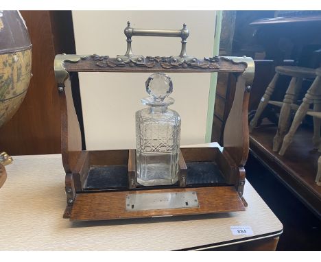 An oak and silver plated tantalus. 