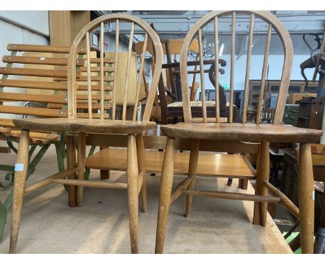 A pair of vintage Ercol light elm spindle back chairs. 
