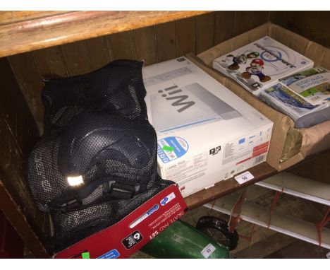 A Wii console, games and 2 sets of skate pads. 