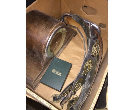 A box including a mantle clock, brass items, metal bar and Irish crystal. 