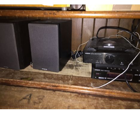 A Hitachi CD / MP3 player, Hitachi amp and pair of speakers. 