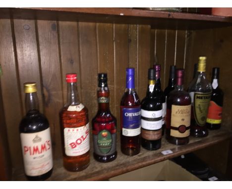 11 bottles of alcoholic beverages, cognac, port, sherry, Metaxa, etc. - some sealed and some open. 