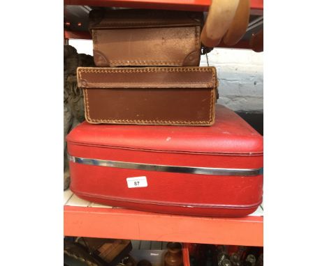 Two vintage cases and an Antler case. 