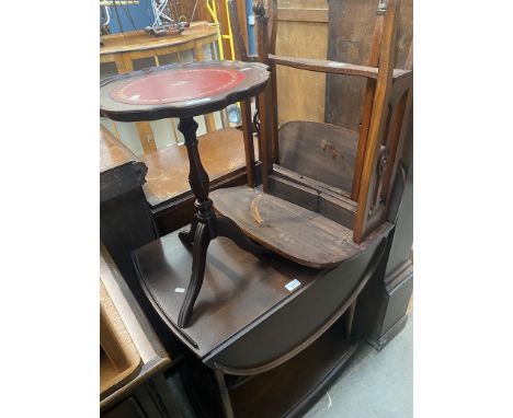 A retro Ercol drop leaf trolley, an Edwardian mahogany sutherland table and a reproduction mahogany wine table. 