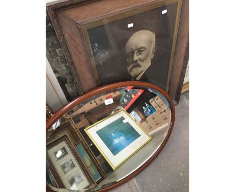 Oval mirror and a large portrait print 