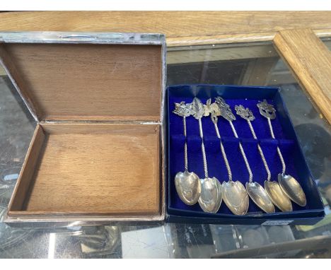 Silver covered cigarette box and a set of white meta spoons 