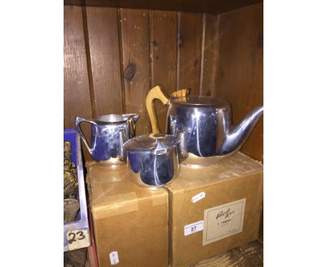 A Picquot ware teapot, cream jug and a sugar bowl 