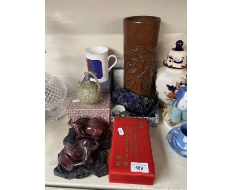 A collection of eastern items including a carved bamboo brush pot,  pottery, jade and carved wood buffalo. 