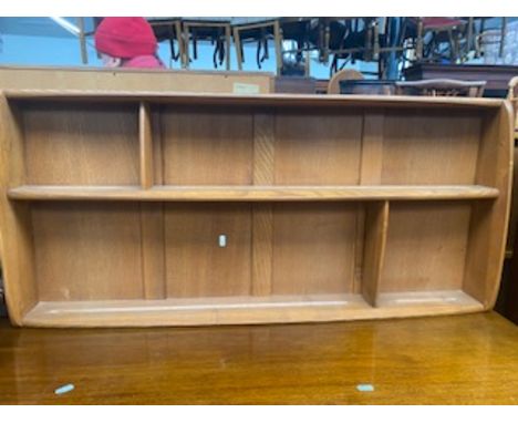A retro Ercol light elm shelving unit.
