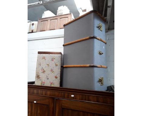 A vintage shipping trunk, an embroidered top stool and a pine framed mirror. 