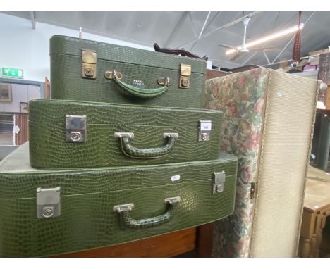 A set of three vintage faux crocodile skin cases by Pukka. 