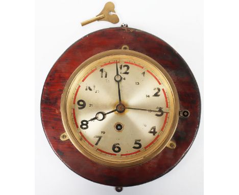 German Ships Clock: Brass housed bulkhead clock , no visible maker, clean 17.5 cms dial with some wear to numbers, mounted on