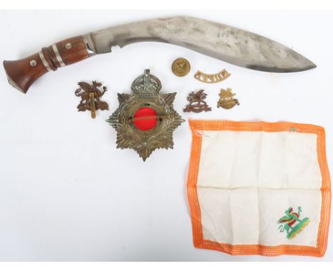 Kukri and Buffs Badges: Swollen blade with decoration to back edge, wood  grip with white metal pommel, overall 42 cms. Kings