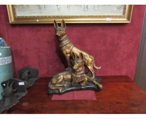 A ceramic group depicting Alsatians on a rocky outcrop, with metal plaque "Vigilance" par petrilly.  Signed J.B. "Depose" 195
