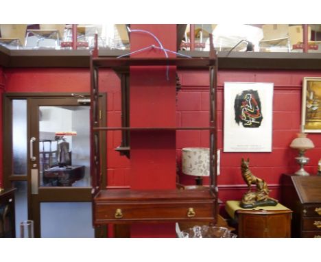 A hardwood three tier shelf with fretwork sides and single drawer