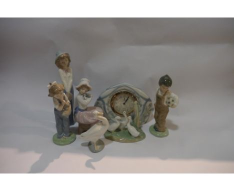 A selection of Lladro and Nao figures and clock (7)