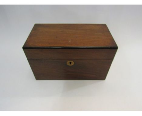 An Edwardian mahogany ebonised tea caddy with lidded compartments 