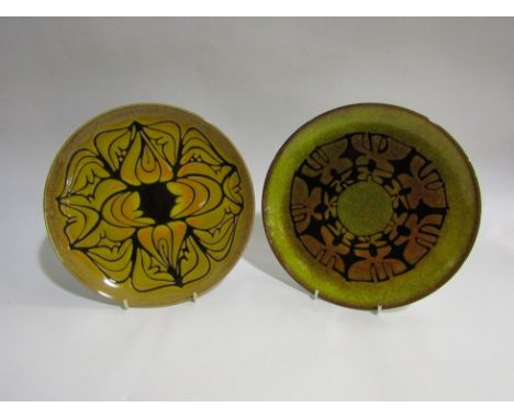 Two Poole Aegean chargers with yellow and black glaze, 25cm diameter