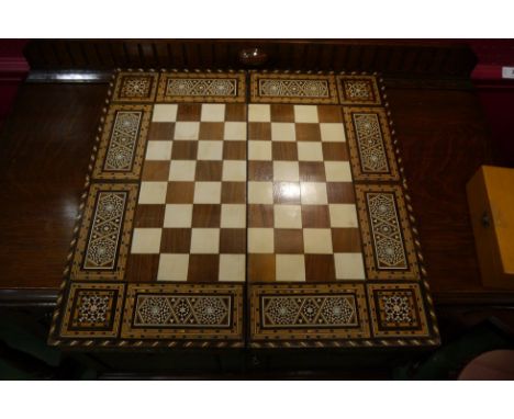 A parquetry inlaid backgammon/chess box, bone and ivorine, with a box of pieces