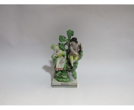 A "Ralph Wood" Pearlware figural group decorated with overglaze enamels circa 1790, 'Pastime', 20cm tall