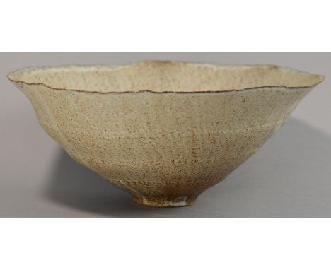 SUTTON TAYLOR (born 1943); an early hand built stoneware bowl, extremely thin walled, undulating rim, matt off white glaze, p