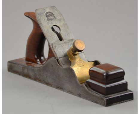 Edward Preston & Sons of Birmingham; a rose wood and dovetailed steel panel plane with 2.5" blade and brass screw, stamped 'E