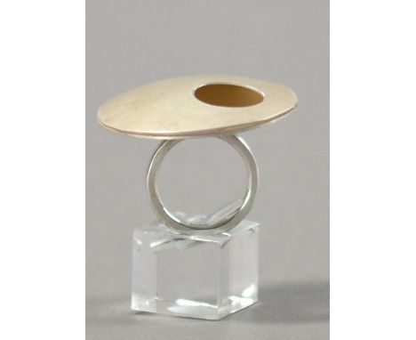 HANNAH SOUTER; a hallmarked silver ring with pierced disks, diameter 4cm, ring size N.

Provenance: Purchased from The Craft 