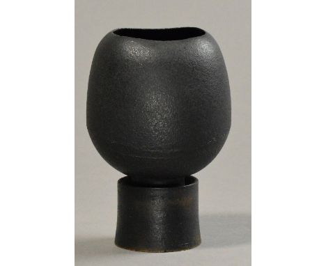 HANS COPER (1920-1981); a stoneware elliptical flower holder on drum base, burnished black slip, impressed HC mark and collec