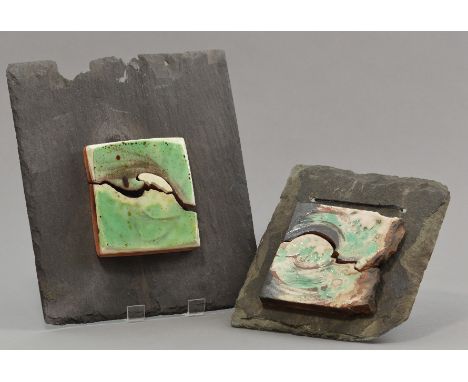 ERICA MATTINGLY (born 1929); two earthenware slip decorated 'broken wave' tiles mounted on slate, tile dimensions 13 x 13.5cm