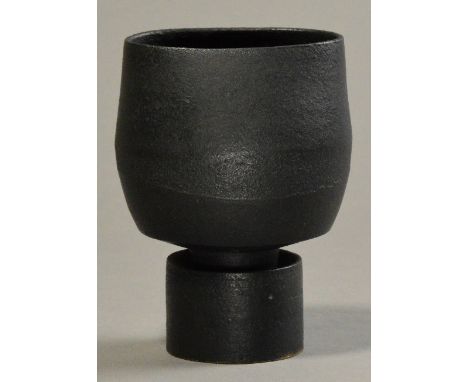 HANS COPER (1920-1981); an oval stoneware flower holder on drum base, burnished manganese black, impressed HC mark, made c. 1