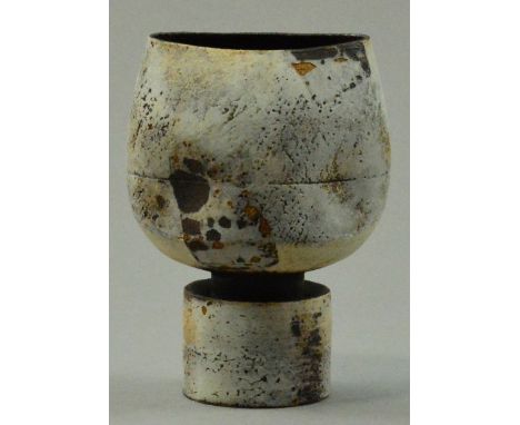 HANS COPER (1920-1981); a stoneware pinched cup form on drum base, white and manganese brown slips on exterior, heavily blist