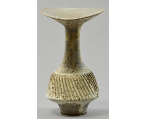 LUCIE RIE (1902-1995); a stoneware bottle, flared undulating rim, heavily fluted, pitted cream/grey glaze, impressed LR mark,