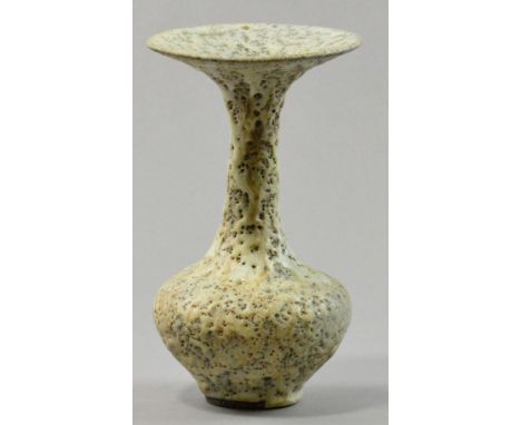 LUCIE RIE (1902-1995); a stoneware bottle, flared rim, eruptive and pitted glaze, impressed LR mark, made c. 1979, height 21.