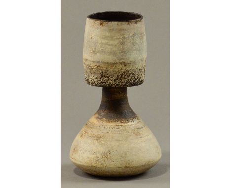 HANS COPER (1920-1981); a stoneware hourglass vase with cylindrical neck, white slip over textured manganese ground, band of 