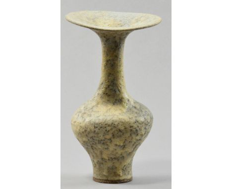 LUCIE RIE (1902-1995); a stoneware bottle, flared undulating rim, lightly pitted cream/brown glaze, impressed LR mark, made c