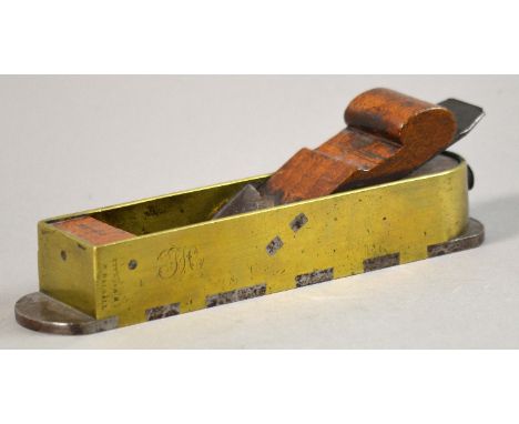 Unattributed; a beech, gun metal and dovetailed steel mitre plane with 2" blade stamped 'MOULSON BROTHERS', the infill stampe