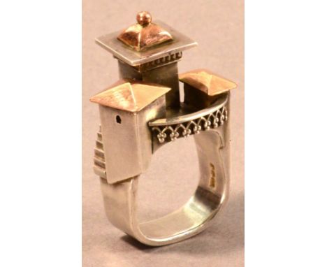 VICKI AMBERY-SMITH (born 1955); a hallmarked silver and yellow gold architectural inspired ring, ring size I.

Provenance: Pu