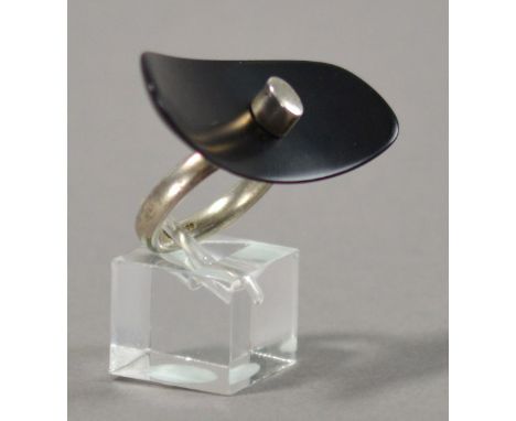 LESLEY STRICKLAND (born 1955); a hallmarked silver ring of large black resin dished oval form, ring size P.

Provenance: Purc